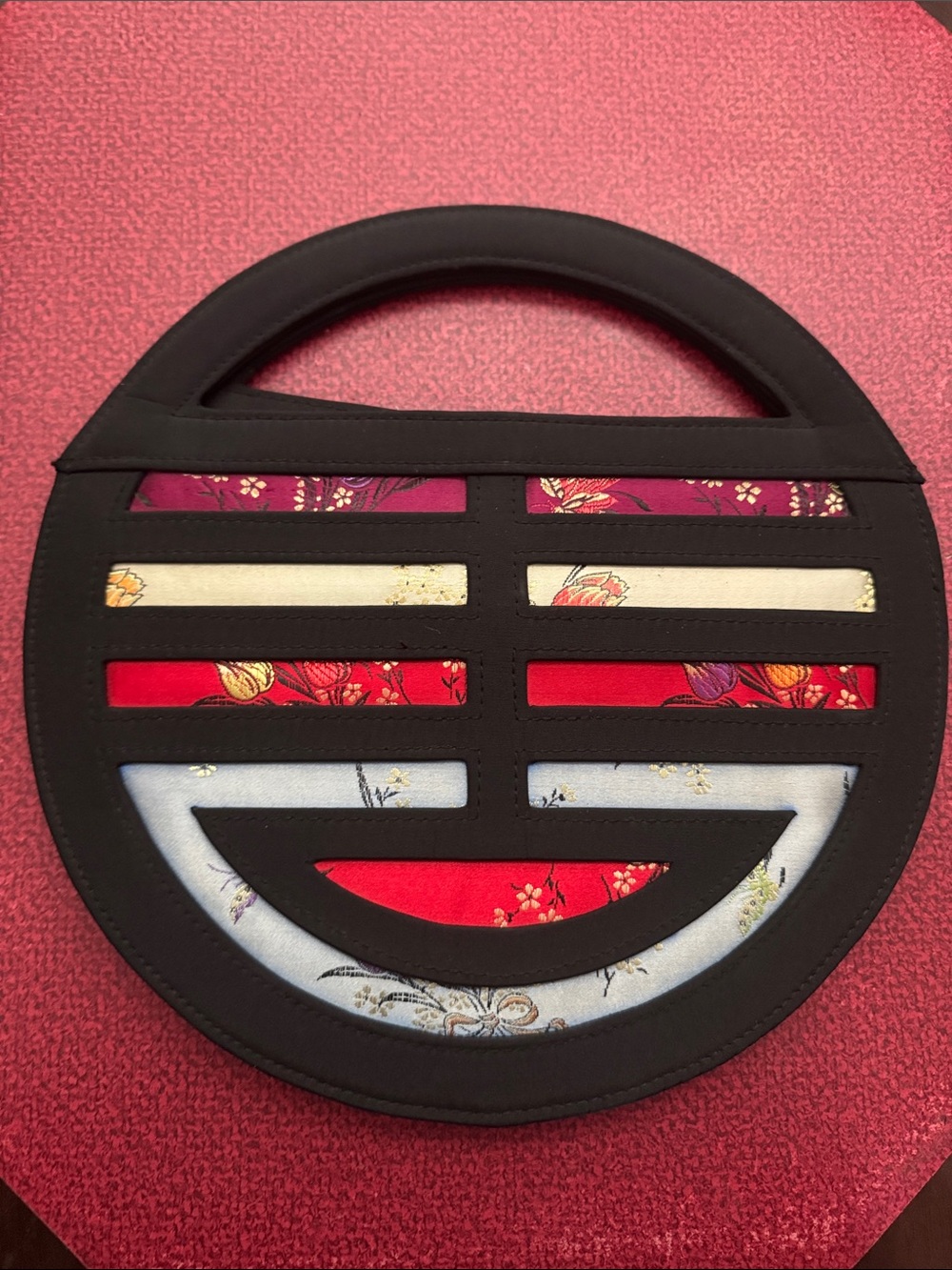 Nolita Round Black Cutout Handbag with Floral Inset
